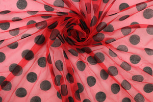  A sheer, semi firm, tulle in red with black dots.