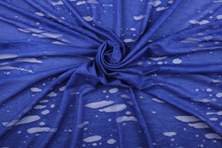 This stretch lycra blend fabric in iridescent blue.