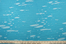 Load image into Gallery viewer, This stretch lycra blend fabric in iridescent sea blue. 
