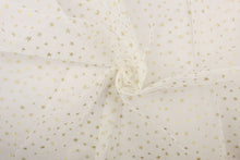 Load image into Gallery viewer,  A sheer, semi firm, tulle featuring sparkly gold stars set against white. 
