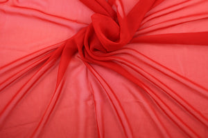 A sheer, semi firm, netting tulle in red . 