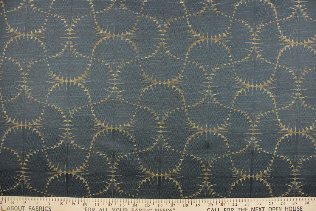 This jacquard fabric features a whimsical print in dark beige on a slate background.  It is great for home decor such as multi-purpose upholstery, window treatments, pillows, duvet covers, tote bags and more.  It has a soft workable feel yet is stable and durable with a rating of 15,000 double rubs. 