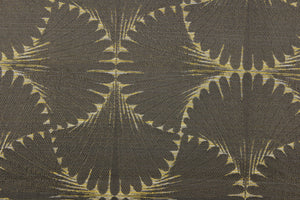 This jacquard fabric features a whimsical print in light gold on a brown background.  It is great for home decor such as multi-purpose upholstery, window treatments, pillows, duvet covers, tote bags and more.  It has a soft workable feel yet is stable and durable with a rating of 15,000 double rubs. 