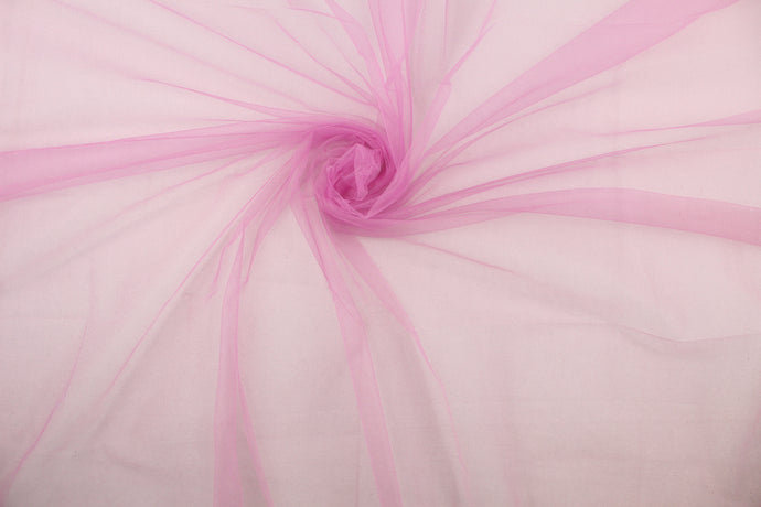 A sheer, semi firm, tulle in pink/purple.