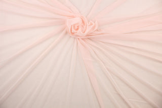 A sheer, light weight, and semi firm tricot in beautiful pink .