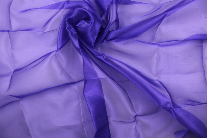 A beautiful sheer satin fabric in a royal purple . 
