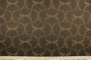 This jacquard fabric features a whimsical print in dark beige on a brown background.  It is great for home decor such as multi-purpose upholstery, window treatments, pillows, duvet covers, tote bags and more.  It has a soft workable feel yet is stable and durable with a rating of 15,000 double rubs.   