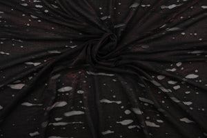 This stretch lycra blend fabric in black with undertones of red. 