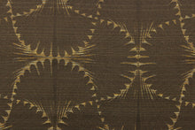 Load image into Gallery viewer, This jacquard fabric features a whimsical print in dark beige on a brown background.  It is great for home decor such as multi-purpose upholstery, window treatments, pillows, duvet covers, tote bags and more.  It has a soft workable feel yet is stable and durable with a rating of 15,000 double rubs. 
