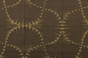 This jacquard fabric features a whimsical print in dark beige on a brown background.  It is great for home decor such as multi-purpose upholstery, window treatments, pillows, duvet covers, tote bags and more.  It has a soft workable feel yet is stable and durable with a rating of 15,000 double rubs. 