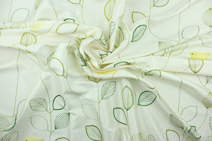 This fabric has an embossed design featuring a yellow bird perched upon green branches on an ivory background.  The slight sheen enhances the design.  Uses include light upholstery, pillows, bedding and window treatments.  