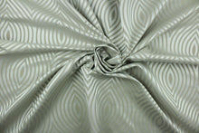 Load image into Gallery viewer, Raleigh features a geometric design in tone on tone silver featuring a slight sheen.  It offers beautiful design, style and color to any space in your home.  It has a soft workable feel and is perfect for window treatments (draperies, valances, curtains, and swags), light duty upholstery, bed skirts, duvet covers, pillow shams and accent pillows.  
