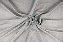 Load image into Gallery viewer, This multi-purpose mock linen in sterling silver with gray tones has a classic raw silk look and is suitable for draperies, curtains, cornice boards and headboards.  We offer this fabric in other colors.
