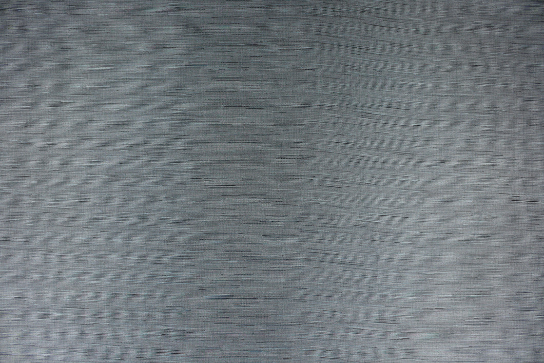 This multi-purpose mock linen in charcoal with blue tones has a classic raw silk look is suitable for draperies, curtains, cornice boards and headboards.  We offer this fabric in other colors.