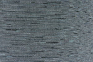 This multi-purpose mock linen in charcoal with blue tones has a classic raw silk look is suitable for draperies, curtains, cornice boards and headboards.  We offer this fabric in other colors.