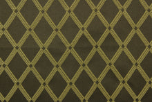 Load image into Gallery viewer, Bavley is a jacquard fabric that features gold diamonds set against a brown background.  A slight sheen enhances the design.  It is great for home décor such as light duty upholstery, window treatments, pillows, duvet covers, tote bags and more.  It has a soft workable feel yet is durable and stable.
