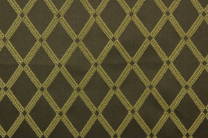 Bavley is a jacquard fabric that features gold diamonds set against a brown background.  A slight sheen enhances the design.  It is great for home décor such as light duty upholstery, window treatments, pillows, duvet covers, tote bags and more.  It has a soft workable feel yet is durable and stable.