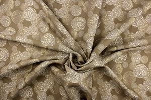 This fabric features a varying shapes of circles in the colors of linen and deep beige.  It has a soft drapable hand and would be ideal for swags, window scarves and drapery panels.