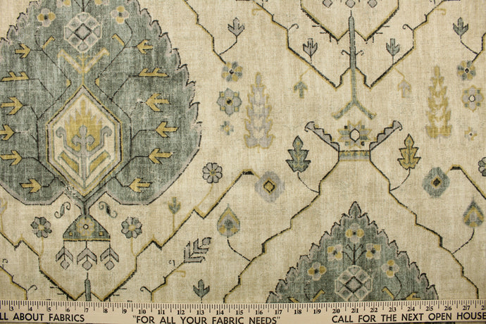 This fabric features a floral design in yellow, beige, gray, black, and seafoam green, 