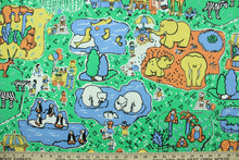 Load image into Gallery viewer, At the Zoo is a vibrant, cheerful print that is perfect for outdoor settings or indoors in a sunny room.  This multi use fabric features a water and stain resistant finish.  Uses include decorative pillows, cushions, chair pads, tote bags and upholstery.  Colors included are orange, yellow, blue, green, white and black.
