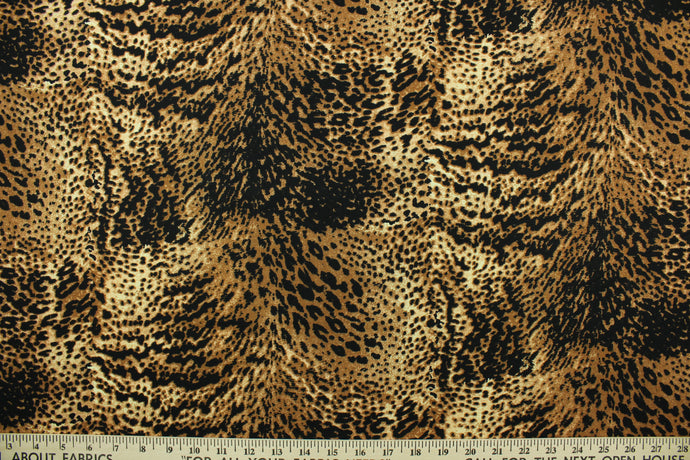 Aquatic features a reptile skin design in black, brown and tan.  The multi use fabric is perfect for window treatments, decorative pillows, custom cushions, bedding, light duty upholstery applications and almost any craft project.  It has a soft workable feel yet is stable and durable.  