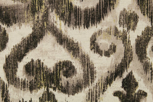  This fabric features a demask design in black, taupe, pale gray, and dull white. 