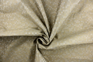 This fabric features tiny circles in varying shades of beige, and taupe and light gold and is perfect for your upholstery needs.  Uses include cushions, pillows, ottomans, headboards, and home decor.  