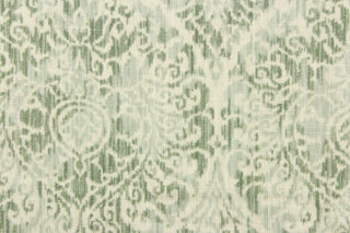 This fabric features a damask pattern in varying shades of green on a off white background.  It has a distressed look enhancing the design.  Uses include drapery, pillows, bedding, light upholstery and home decor.  It has a soft workable hand and is durable with 20,000 double rubs.