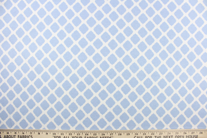 This printed flannel features a lattice design in white and blue.  Uses include apparel, bedding, pillows, home decor and crafting.  This fabric has a soft workable feel. 
