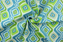 Load image into Gallery viewer, Rippled is a bright geometric design in shades of blue, green, light khaki and white.  It is perfect for outdoor settings or indoors in a sunny room.  It is stain and water resistant and can withstand up to 700 hours of direct sun exposure.  Uses include decorative pillows, cushions, chair pads, tote bags and upholstery.  We offer this pattern in several colors.

