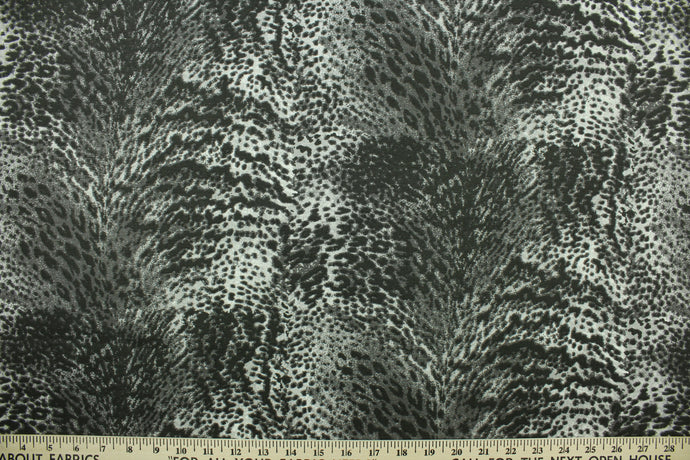 Aquatic features a reptile skin design in charcoal and black.  The multi use fabric is perfect for window treatments, decorative pillows, custom cushions, bedding, light duty upholstery applications and almost any craft project.  It has a soft workable feel yet is stable and durable.  