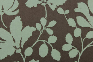 This fabric features a large-scale floral pattern in light olive green on a rich brown background.  The slight sheen enhances the design.  It would be great for home decor such as multi-purpose upholstery, window treatments, pillows, duvet covers, tote bags and more.  It has a soft workable feel yet is stable and durable.