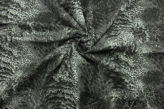 Aquatic features a reptile skin design in charcoal and black.  The multi use fabric is perfect for window treatments, decorative pillows, custom cushions, bedding, light duty upholstery applications and almost any craft project.  It has a soft workable feel yet is stable and durable.  
