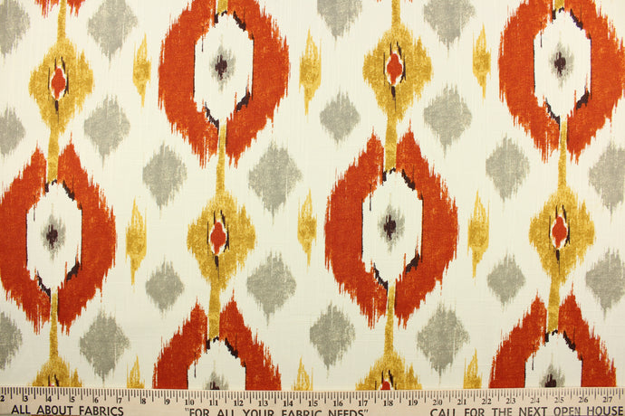 This multi-purpose fabric features a large ikat design in gray, orange, yellow and neutral. It will stand up to abrasion and tension to bring long lasting beauty to your home.  Uses include drapery, headboards, bedding, accent pillows, cushions, slip covers and upholstery.
