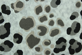 This fabric features a leopard print design in black, gray, and brown on a light gray background.  The multi use fabric is perfect for window treatments, decorative pillows, custom cushions, bedding, light duty upholstery applications and almost any craft project.  It has a soft workable feel yet is stable and durable.  