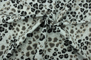 This fabric features a leopard print design in black, gray, and brown on a light gray background.  The multi use fabric is perfect for window treatments, decorative pillows, custom cushions, bedding, light duty upholstery applications and almost any craft project.  It has a soft workable feel yet is stable and durable.  