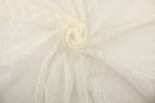 This lace features a woven in cream