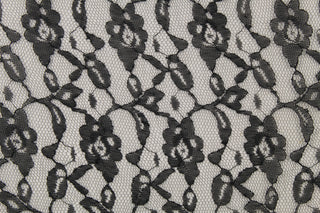 This lace features a woven floral design in black . 