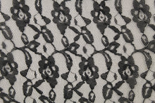 Load image into Gallery viewer, This lace features a woven floral design in black . 
