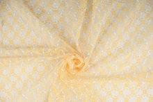 Load image into Gallery viewer, This lace features a woven floral design in golden yellow and white.
