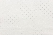 Load image into Gallery viewer,  This printed flannel features polka dots in grey on a solid white background.  Uses include apparel, home decor and crafting.  This fabric has a soft workable feel. 
