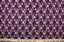Load image into Gallery viewer, This lace features a woven floral design in a rich dark purple.
