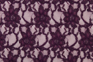 This lace features a woven floral design in a rich dark purple.