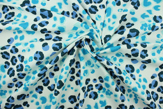 This fabric features a leopard print design in blue, aqua, teal and black on a white background.  The multi use fabric is perfect for window treatments, decorative pillows, custom cushions, bedding, light duty upholstery applications and almost any craft project.  It has a soft workable feel yet is stable and durable.  