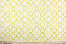 Load image into Gallery viewer, This printed cotton twill fabric features a geometric design in yellow and green on a white background.  It is perfect for window treatments, decorative pillows, handbags, light duty upholstery applications.  This fabric has a soft workable feel yet is stable and durable with 50,000 double rubs.  
