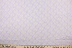 This lace features a woven floral design in light purple.
