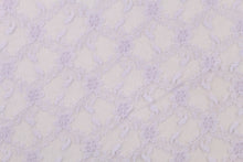 Load image into Gallery viewer, This lace features a woven floral design in light purple.
