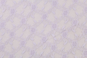 This lace features a woven floral design in light purple.