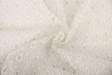 Load image into Gallery viewer, This lace features a woven floral design in white with a gold outline. 
