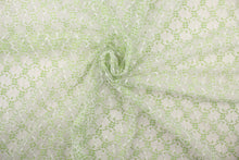 Load image into Gallery viewer, This lace features a woven floral design in green and white . 
